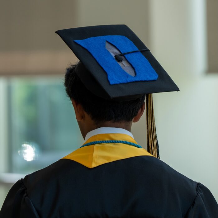 The back of Abhi's graduation cap, decorated with a Duke D
