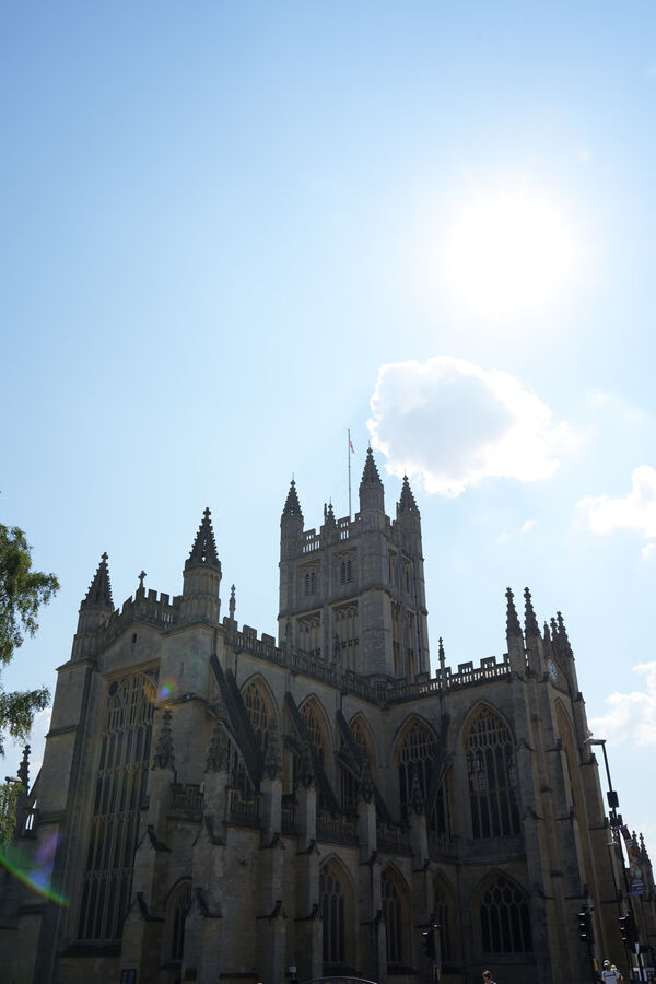 Bath Abbey with the sun breaking above its tower